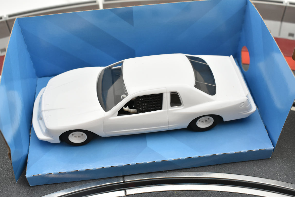 White slot car in its open box packaging for Scalextric C4077