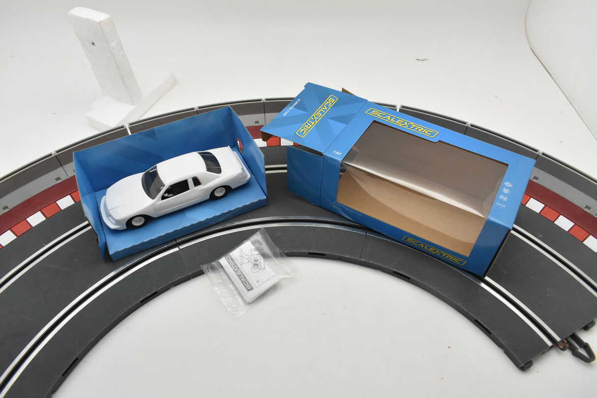 White Ford Thunderbird model car in open box on track section for Scalextric C4077