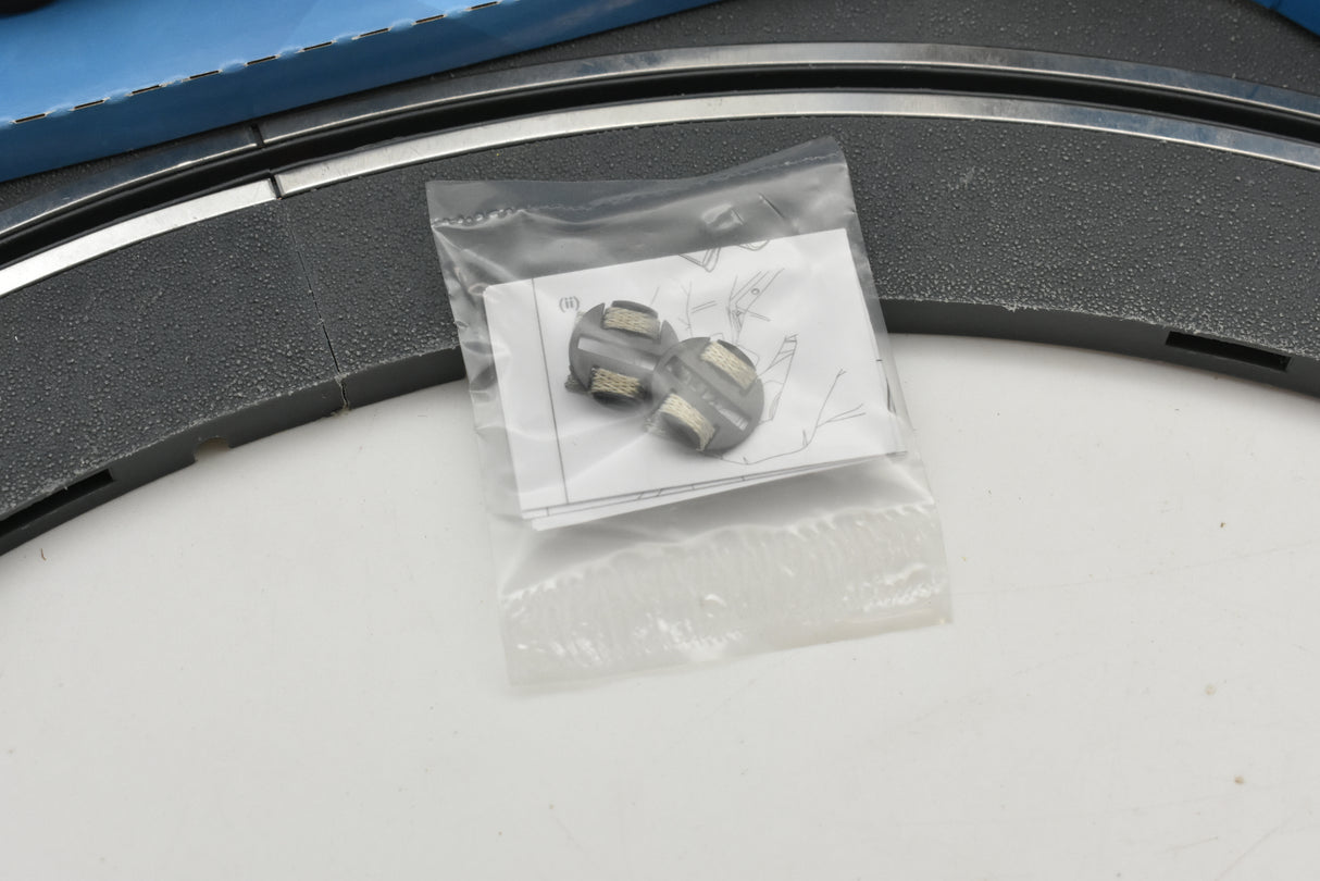 Small bag containing two silver wheel axles for a model car for Scalextric C4077
