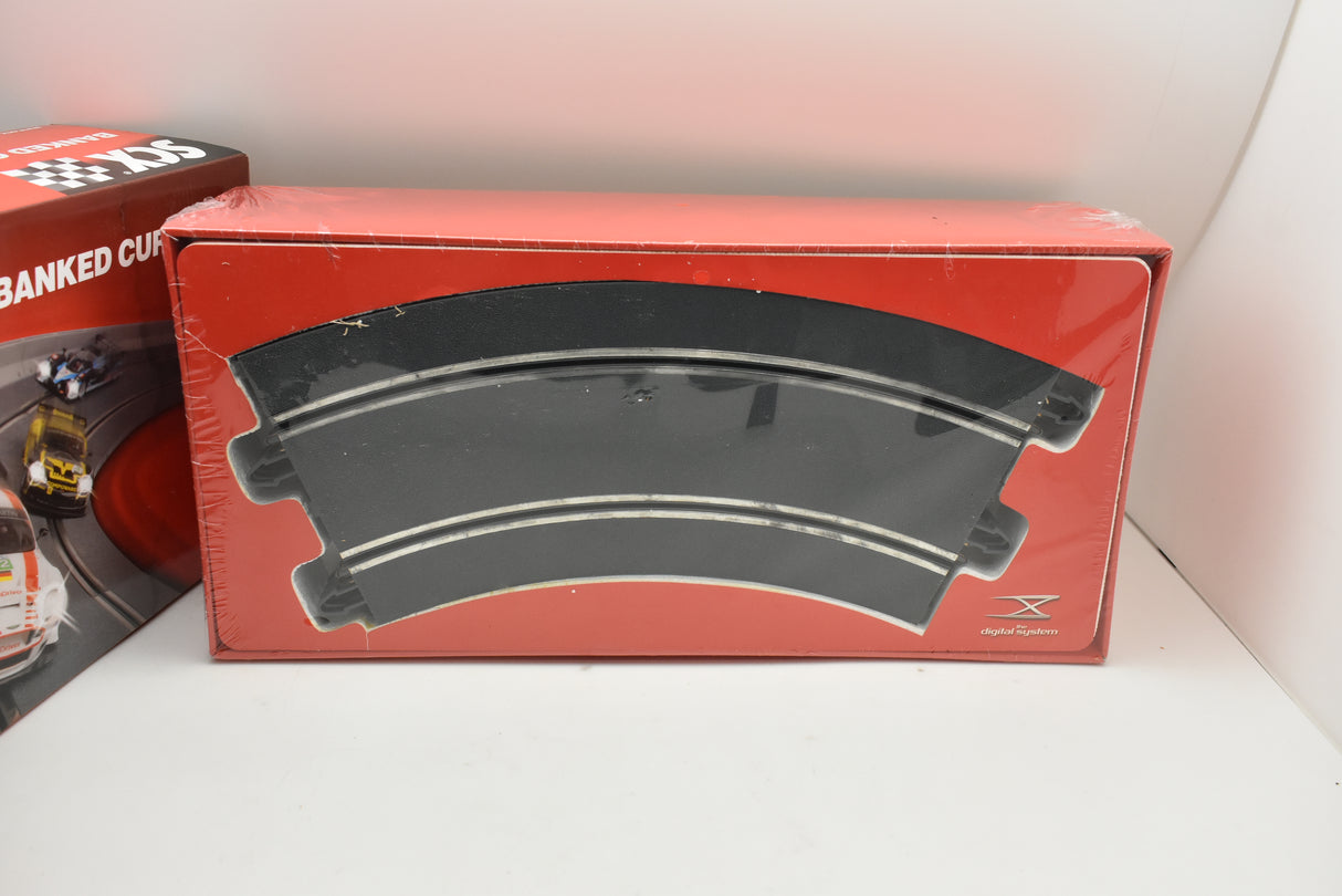 Red box containing a curved track piece for model cars for SCX B02510X100