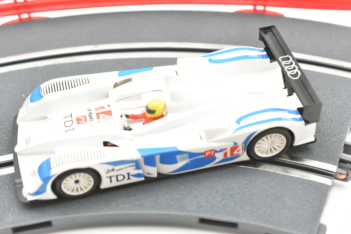White and blue slot car replica of an Audi R10 TDI race car for SCX A10300X3U0, front view