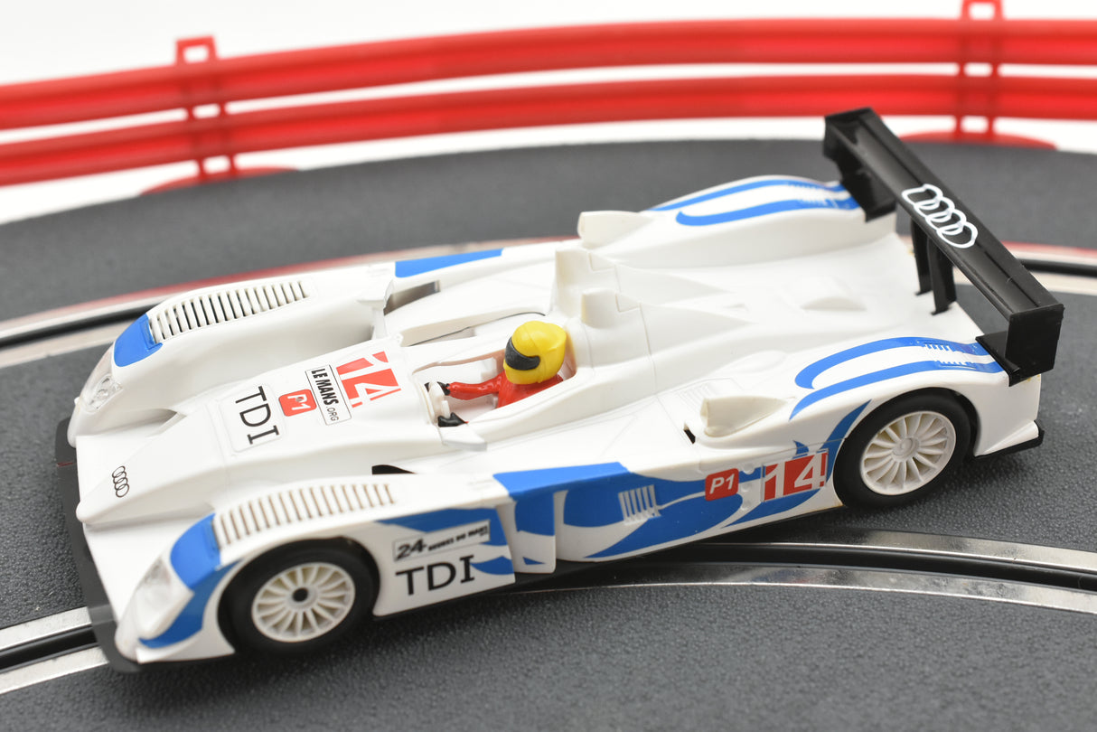 White and blue slot car replica of an Audi R10 TDI race car for SCX A10300X3U0, rear view