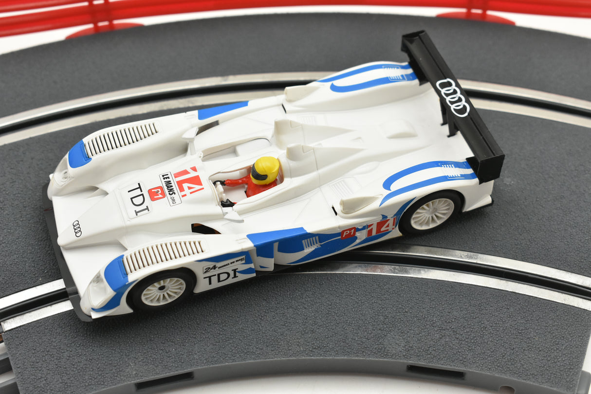 White and blue slot car replica of an Audi R10 TDI race car for SCX A10300X3U0, side view
