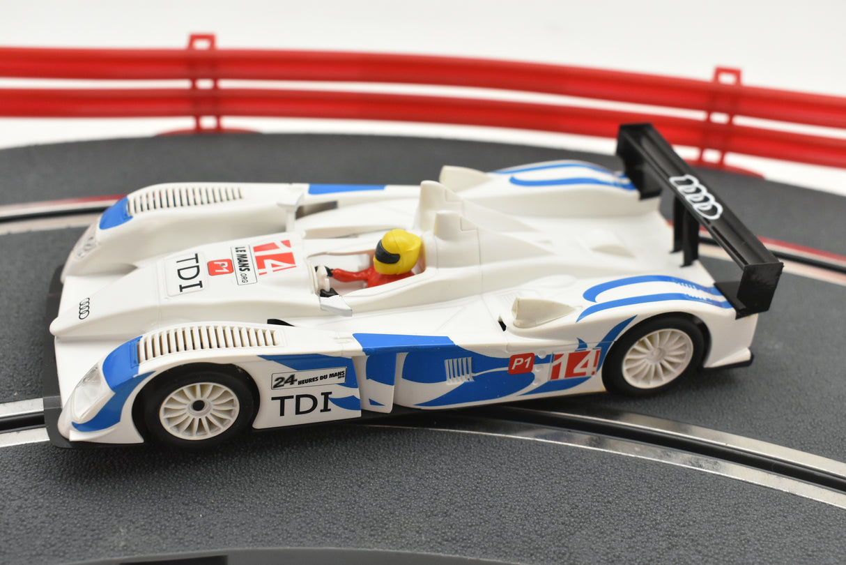 White and blue slot car replica of an Audi R10 TDI race car for SCX A10300X3U0, alternate view