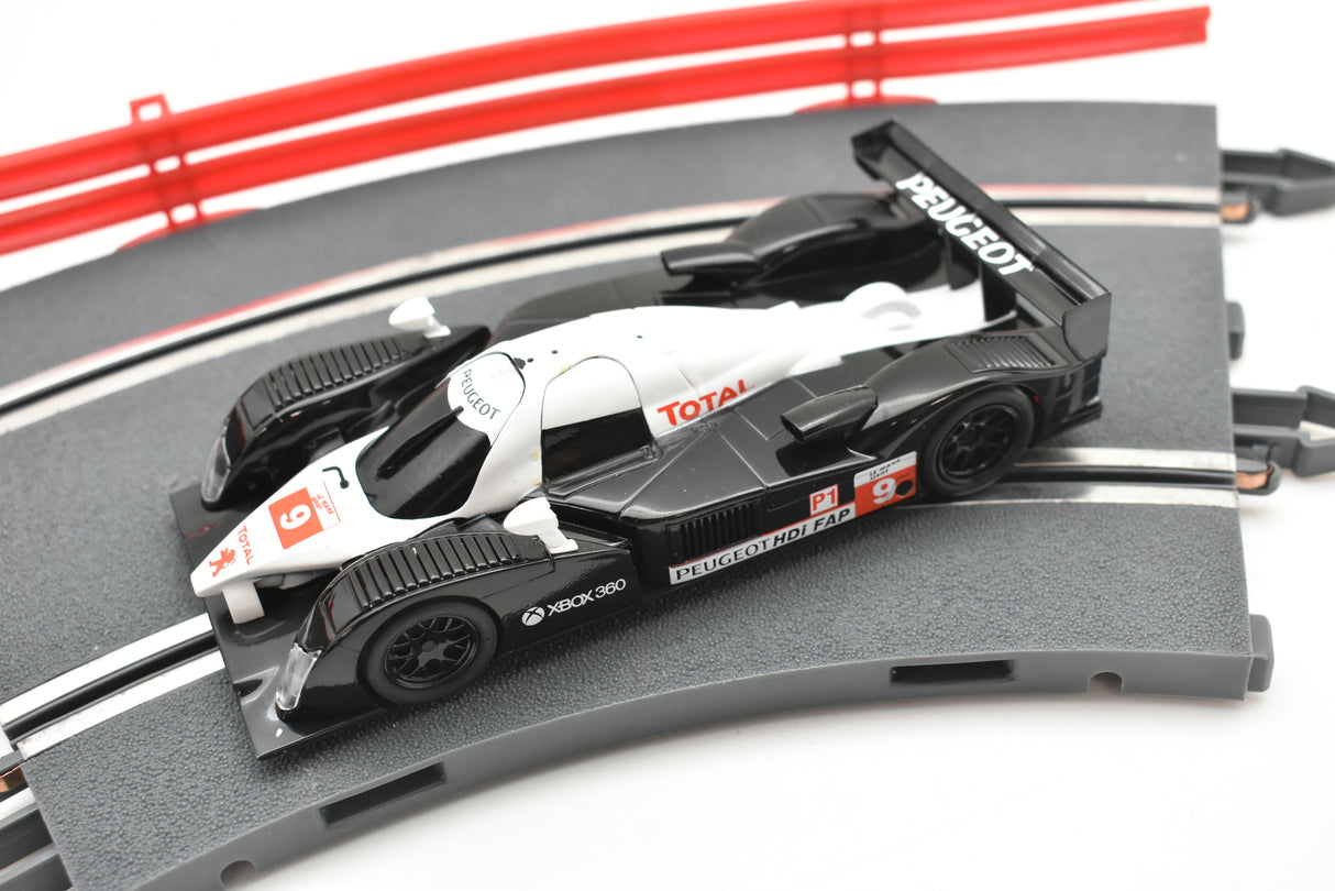 Scale slot car replica of a Peugeot 908 HDI FAP race car for SCX A10300X3U0, front view