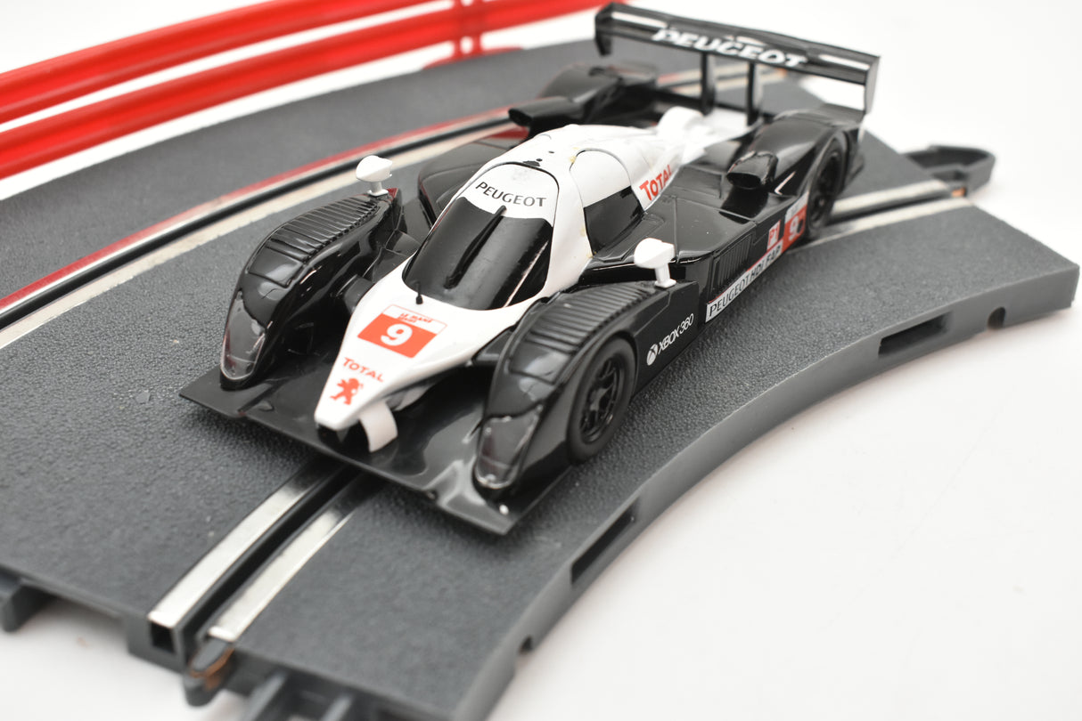 Scale slot car replica of a Peugeot 908 HDI FAP race car for SCX A10300X3U0, rear view