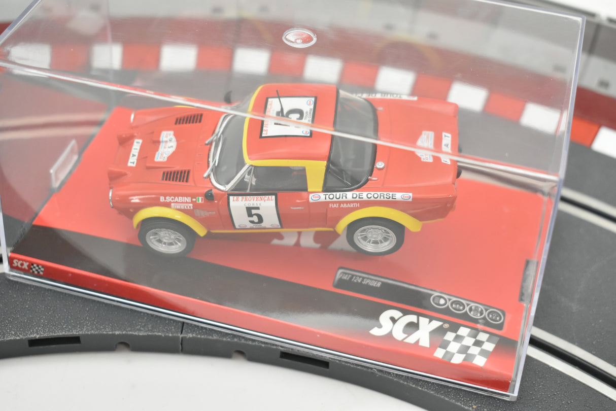 Red slot car replica of a Fiat 124 Abarth Spider race car for SCX A10220X3U0