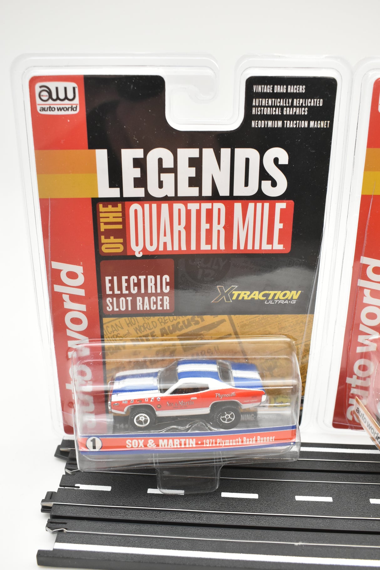 Three slot cars in clear blister packaging on a track base for ZZAutoworldexpired SC351