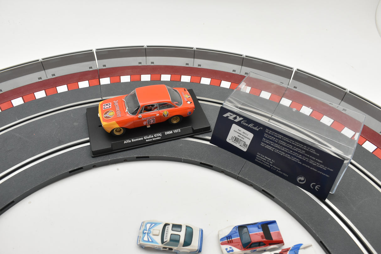 Scale model car on track with product information card for Fly Car Model 88312