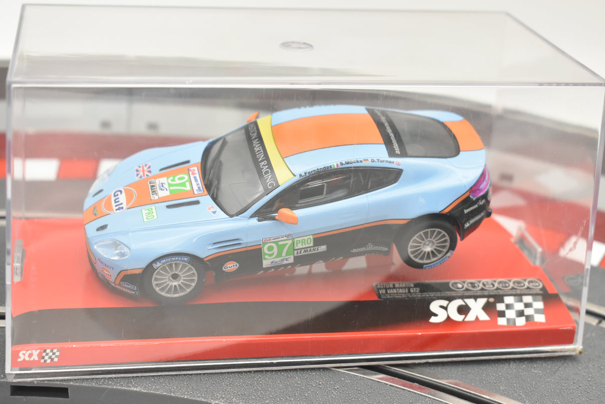 Blue and orange Aston Martin Vantage race car model in clear case for SCX A10116X3U0
