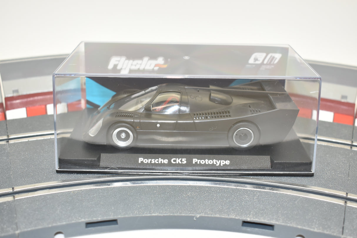 Slot car of the Porsche CK5 Prototype car in a clear display case for Fly Slot 060301