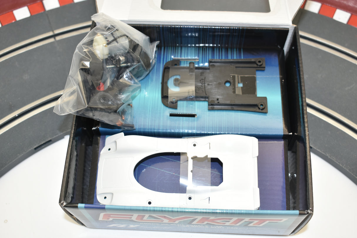 Porsche 908 model kit parts laid out in an open box for Fly Car 88311