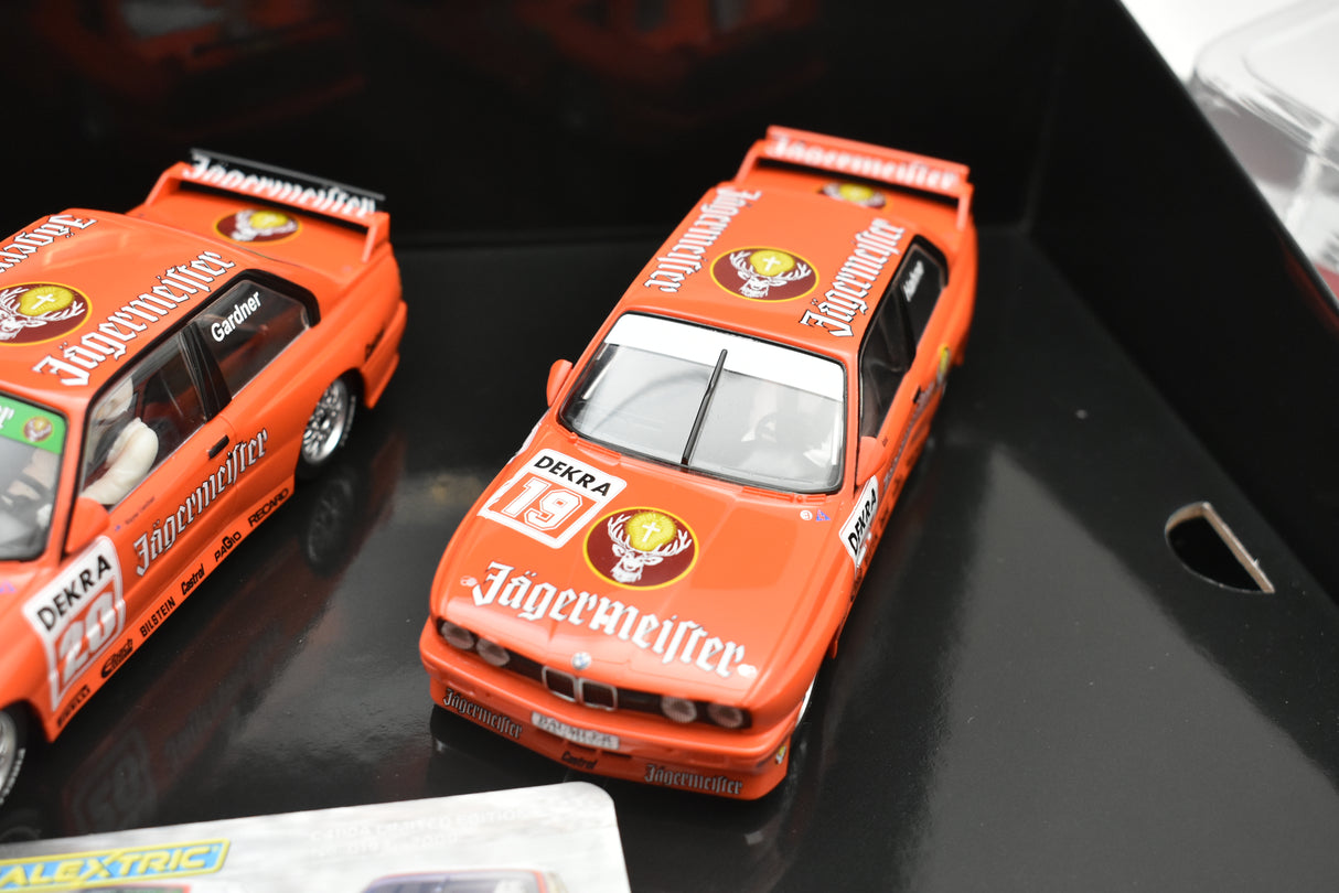 Orange slot cars of BMW E30 M3, Jagermeister livery for Scalextric C4110A