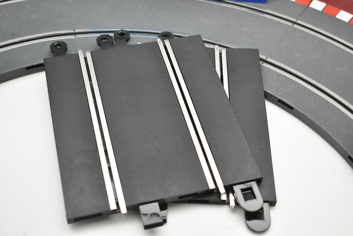 Two black model train track sections with silver details for Scalextric C8222