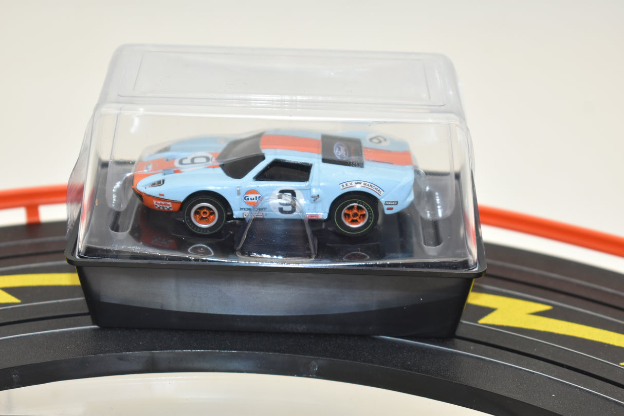 Blue and orange Gulf Ford GT slot car in clear plastic case for Auto World SC0006, rear view