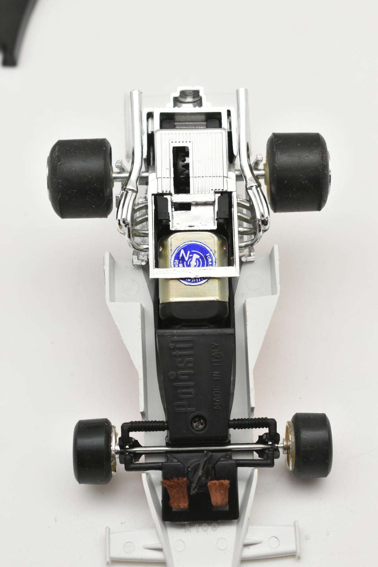 Toy car replica, McLaren Texaco, showing detailed mechanical parts for Polistil Evolution ART A.100