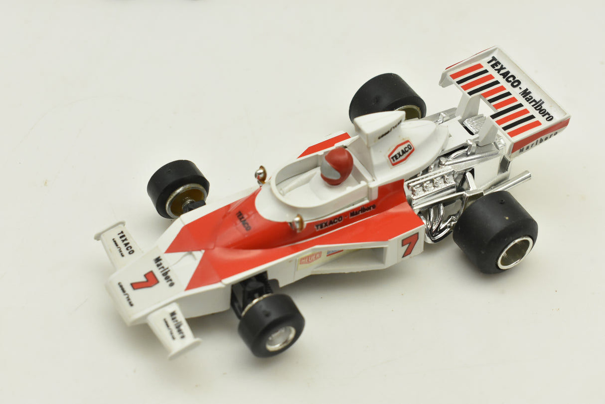 Red and white McLaren race car toy with Texaco and Marlboro decals for Polistil Evolution ART A.100