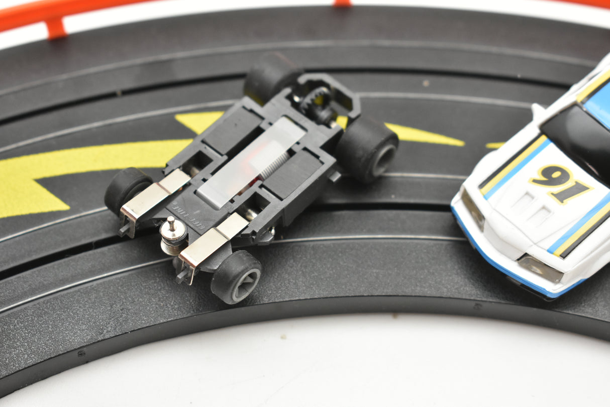 NASCAR race car toy on a track, white, blue, and yellow for Life-Like 13016B