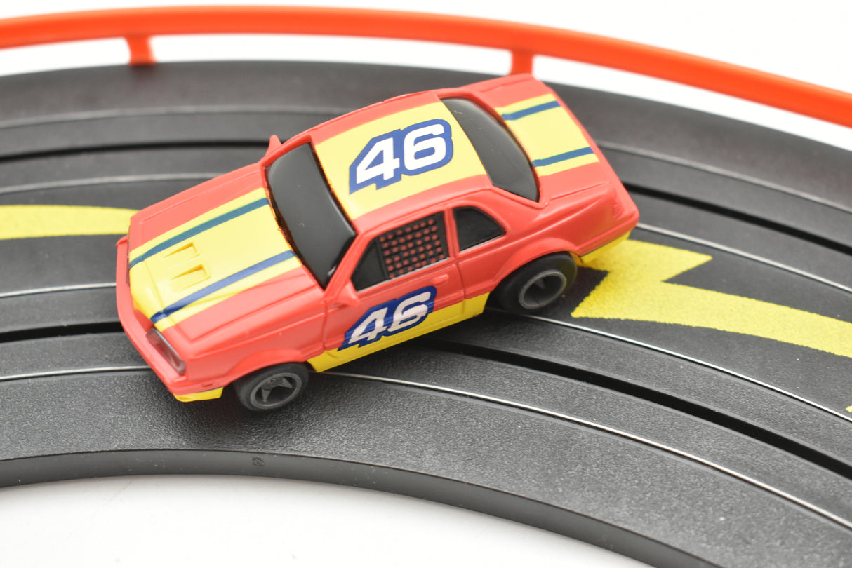 Red and yellow race car with number 46 on a track for Life-Like 13017B