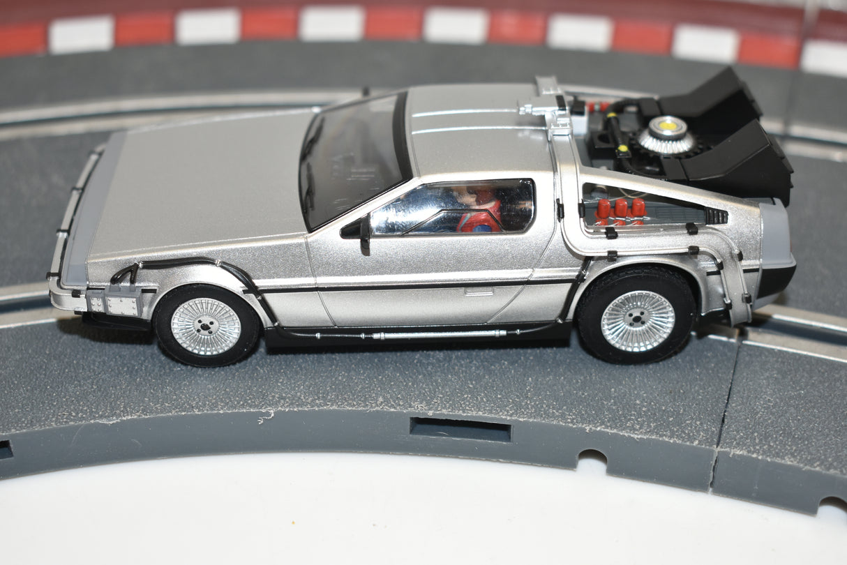 Silver DeLorean time machine model car on a track for Scalextric C4117