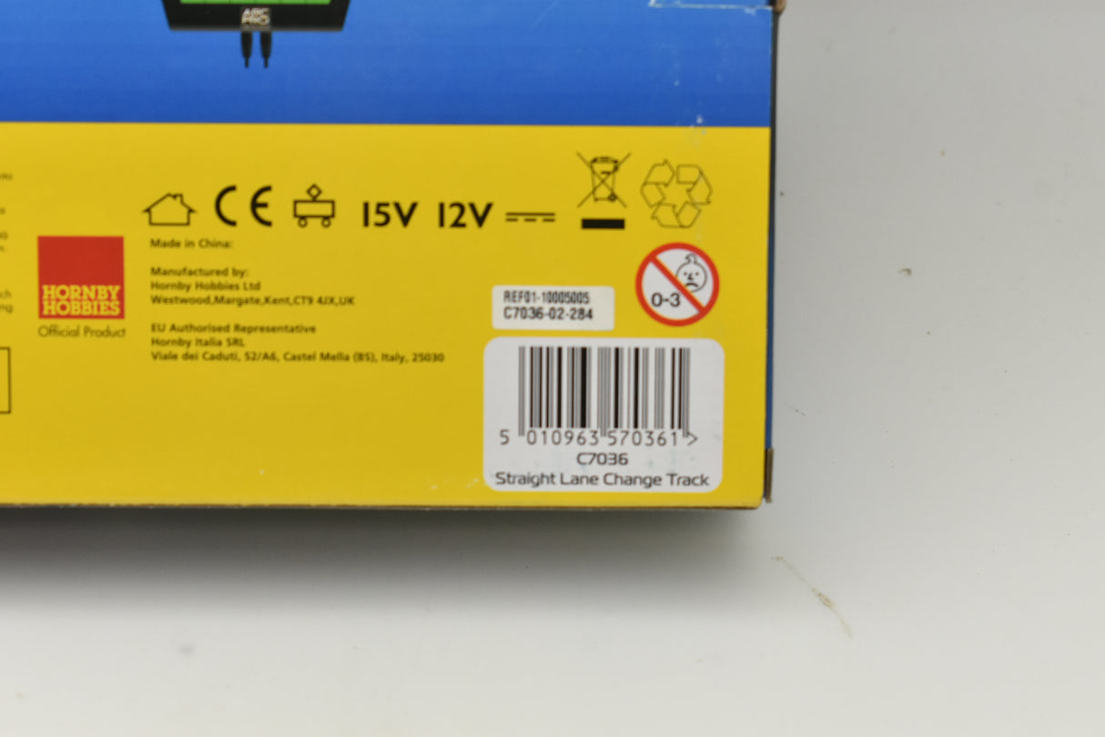 Product box showing straight lane change track details and electrical specifications for Scalextric C7036