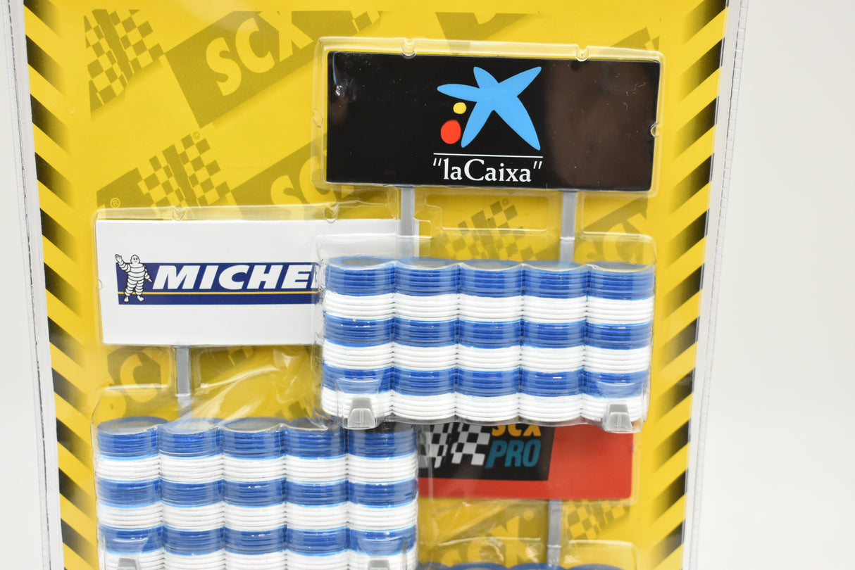 Blue and white striped barrier barricades with "la Caixa" banner for SCX 88100