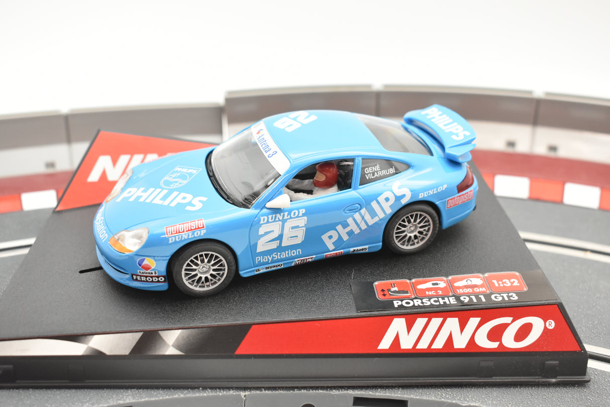 Blue slot car Porsche 911 GT3 race car on a track mat for Ninco 50242