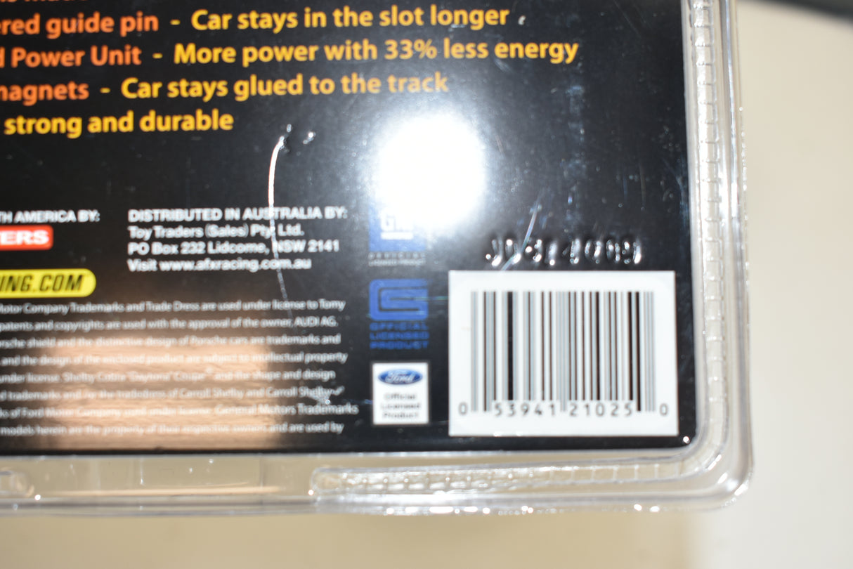 Product packaging showing car racing accessories for a Ford Fusion for AFX/Racemasters 21025