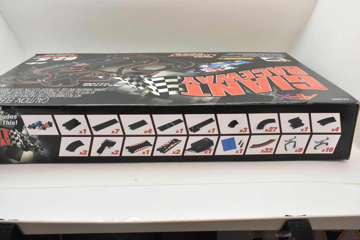 Raceway track pieces laid out on a black box for building a race course for AFX/Racemasters 22020