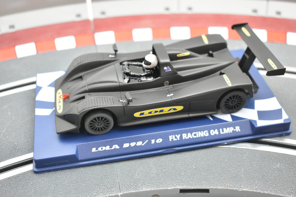 Black and yellow race car model on a blue and white checkered base for Fly Car 07059, rear view