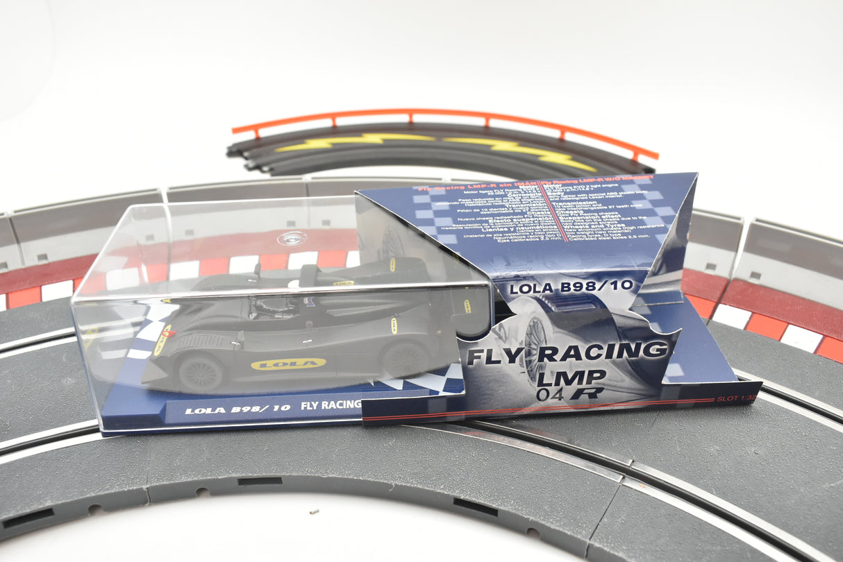 Model car in clear case on track section with packaging for Fly Car 07059