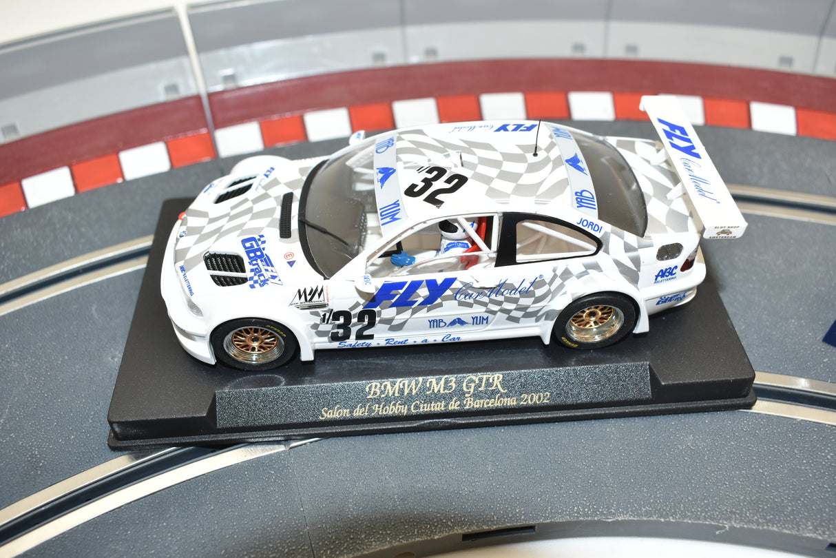 White BMW M3 GTR race car model on a display base for Fly Car 88024