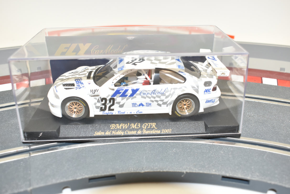 Slot car of a BMW M3 GTR race car displayed in a clear case for Fly Car 88024