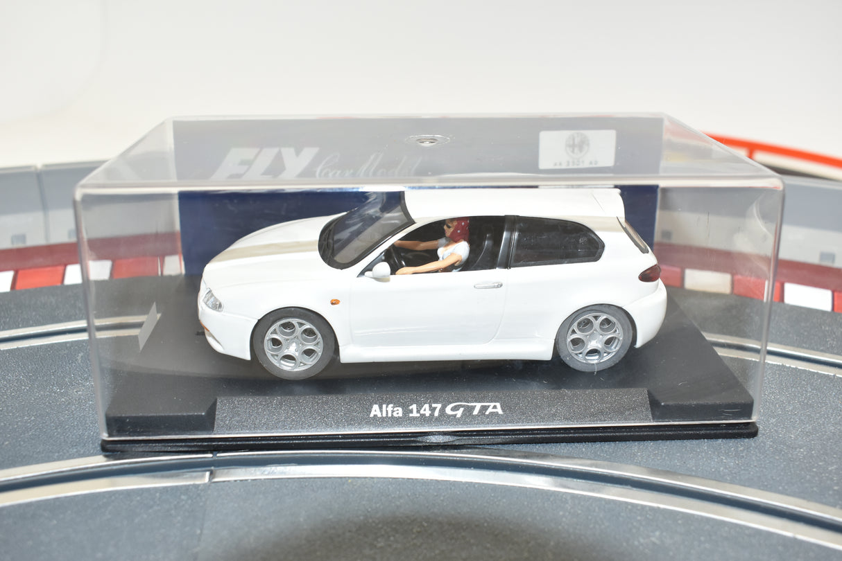 White slot car of an Alfa 147 GTA car in a display case for Fly Car 88105