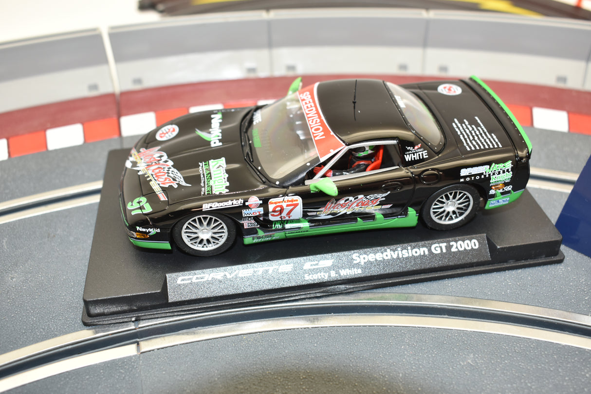 Black and green Corvette race car model on a display base for Fly Car A541