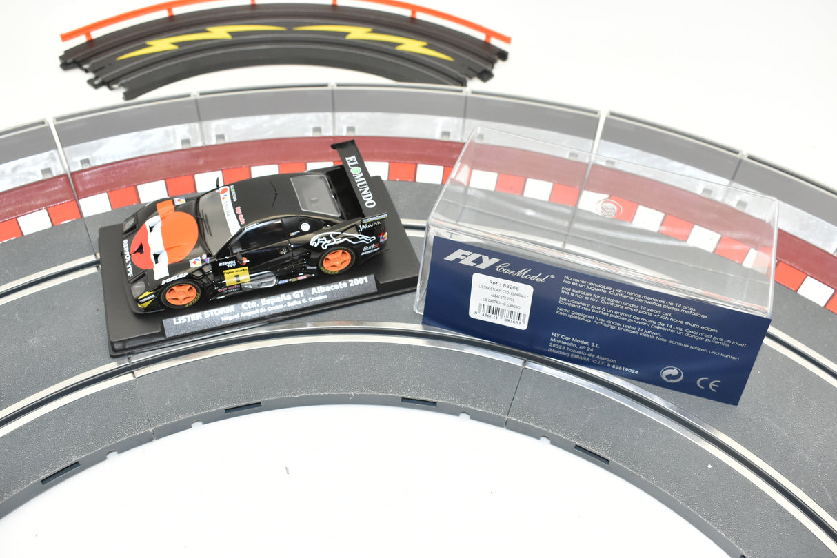 Race car model on track with product information card for Fly Car 88265