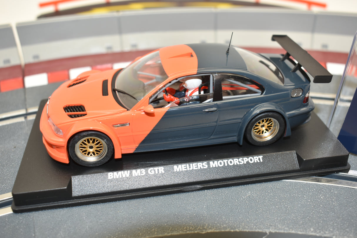 Orange and gray slot car of a BMW M3 GTR race car for Fly Car E-280