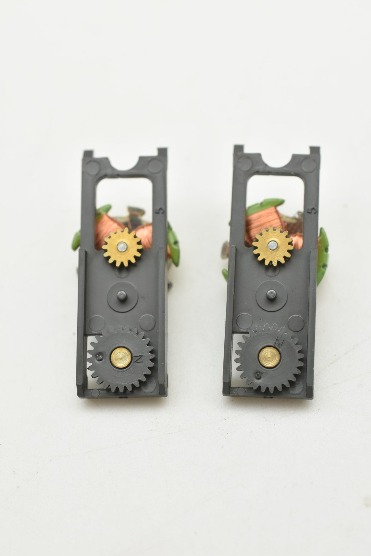 Two gray mechanical top plates with visible gears and green accents for Aurora AFX 1750-061