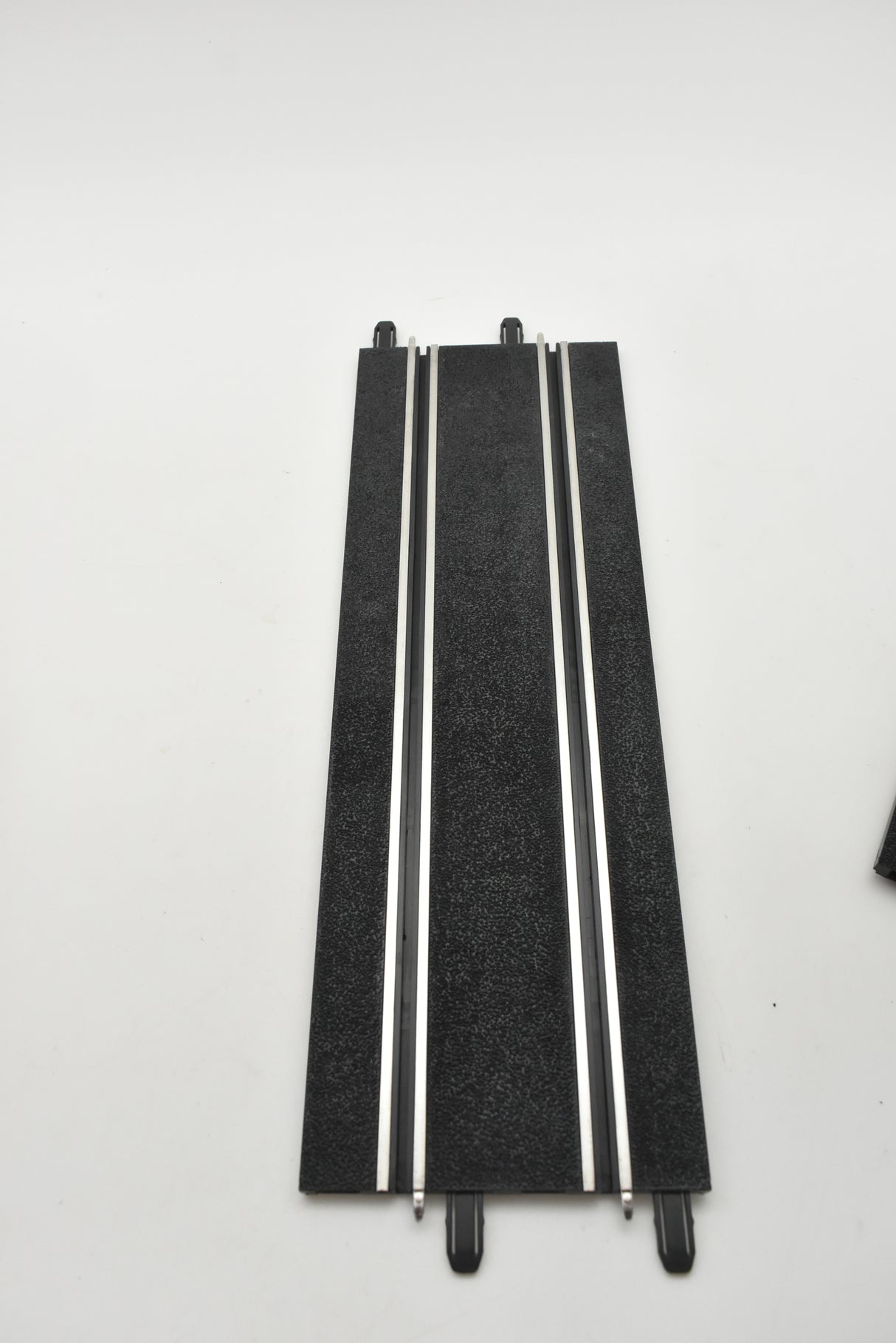 Two straight, black mounting tracks for compact display systems for SCX Compact SC-01.002
