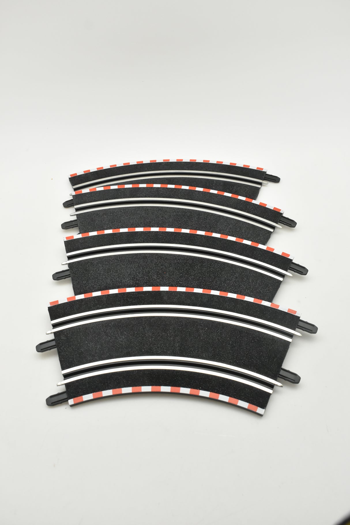Curved track pieces for miniature train layout, forming a gentle arc for SCX Compact SC-01.023