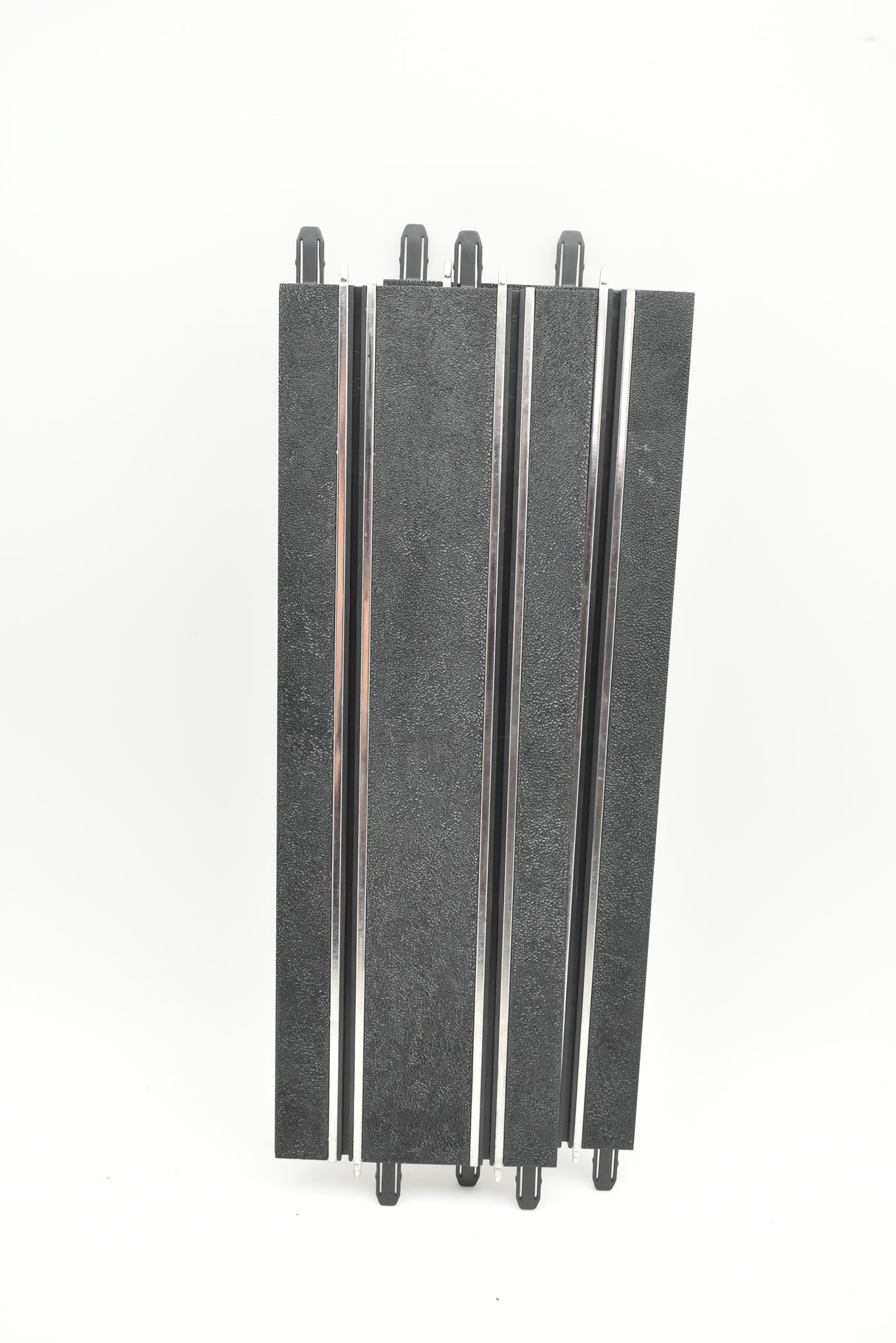 Three straight, dark-colored tracks with mounting hardware for SCX Compact SC-01.002