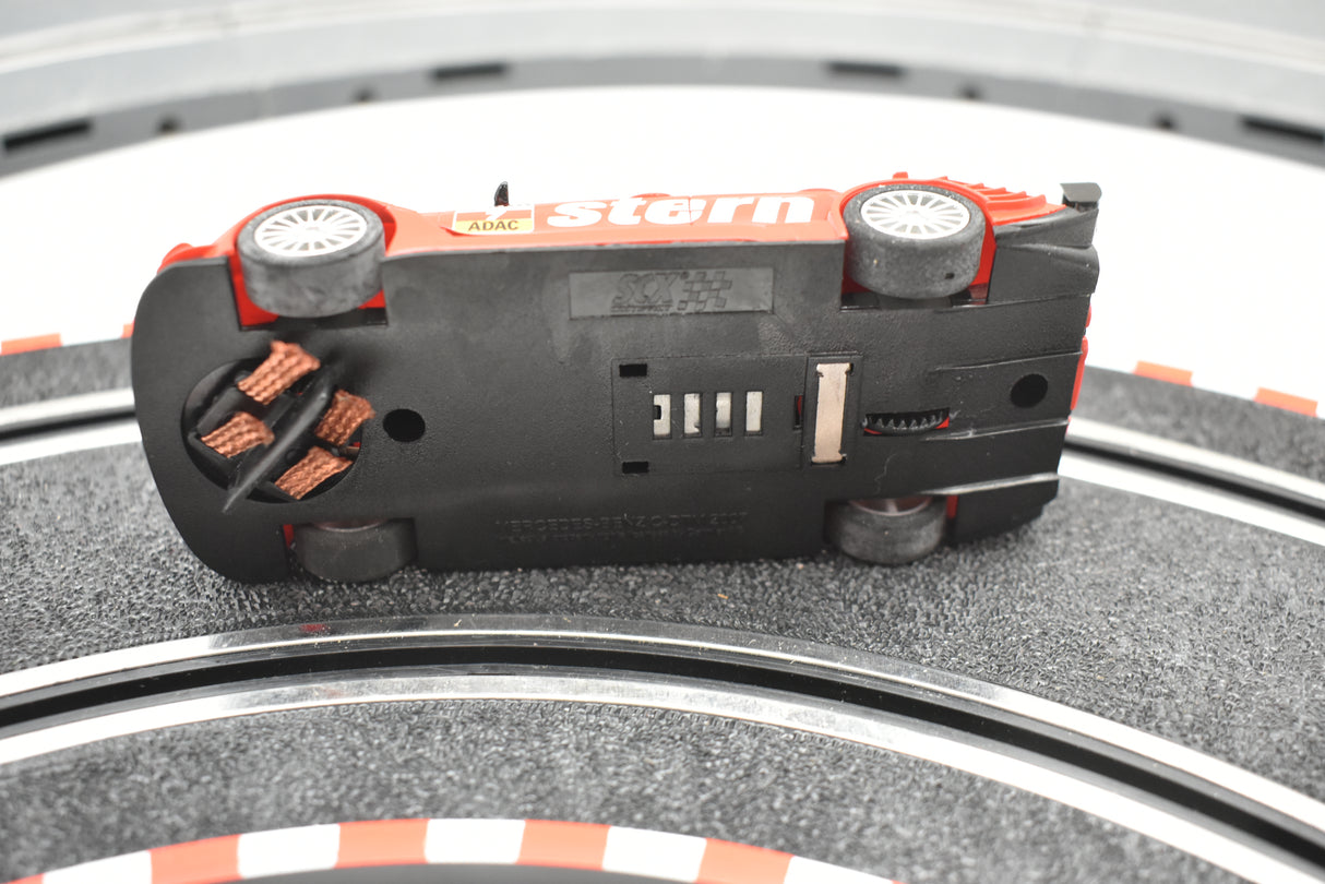 Small slot car toy on a racetrack surface for SCX Compact C10185X300