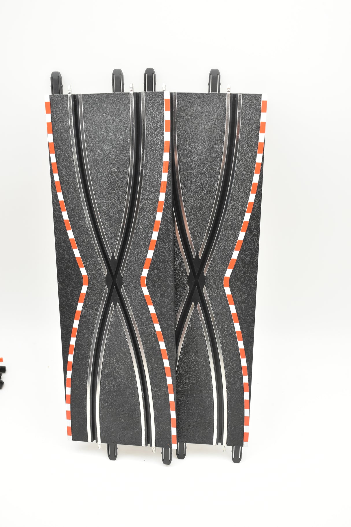 Two black, curved, compact suitcases with orange and white stripes for SCX Compact SC-01.029