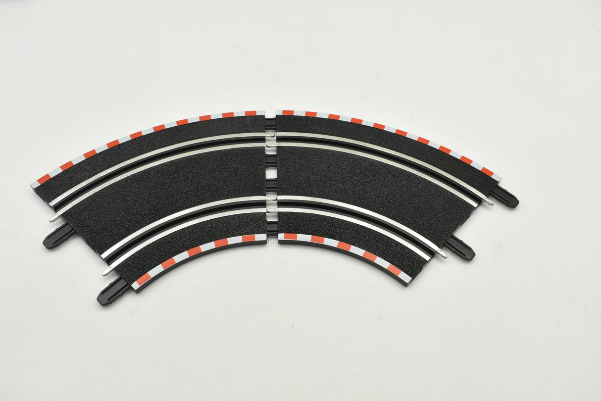 Curved track section for model train layout, featuring black and white markings for SCX Compact SC-01.011