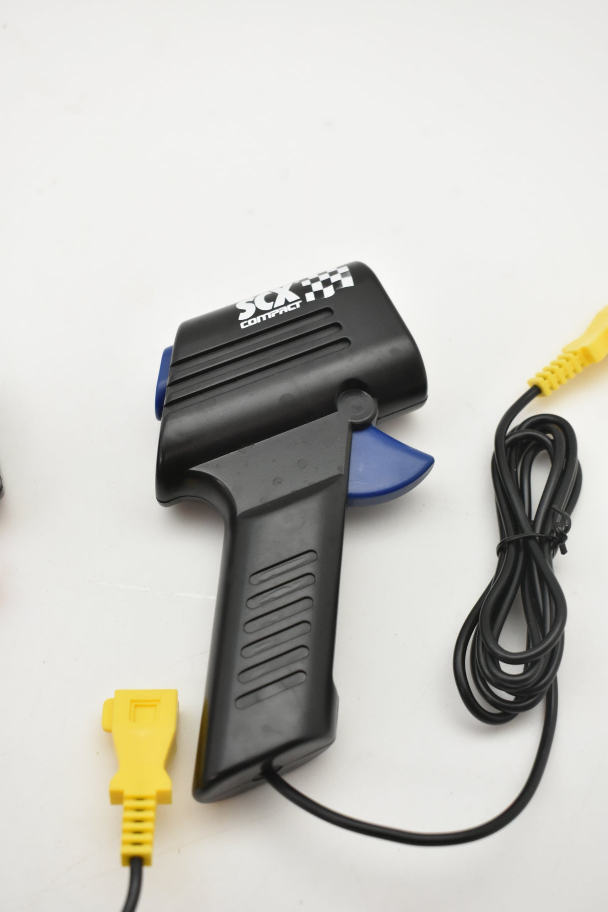 Black and blue hand throttle with attached power cord and connector for SCX Compact SP2009-007