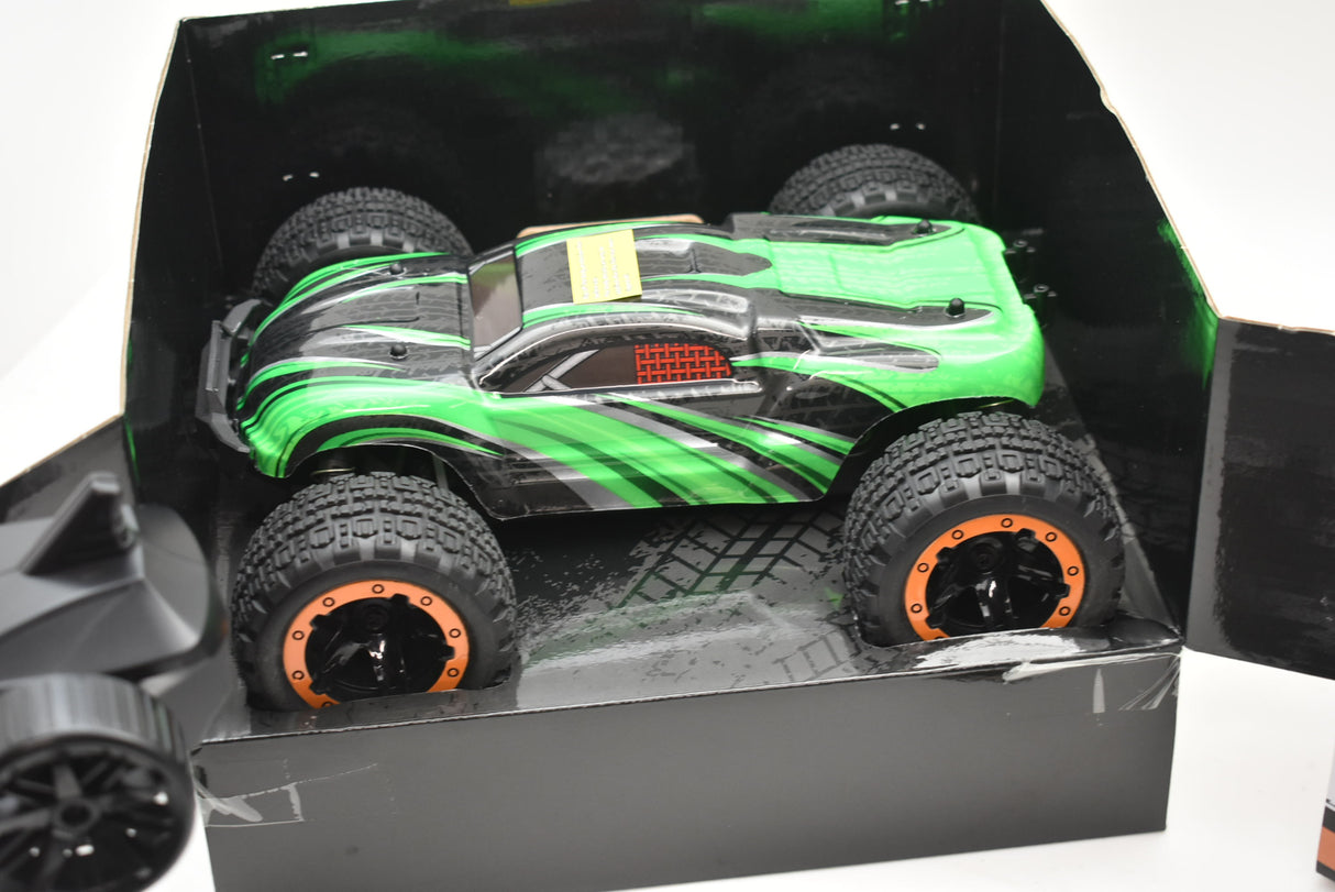 Green and black remote-controlled monster truck in its open box for ORANGE/GREEN IMX19025, package view, product view 20