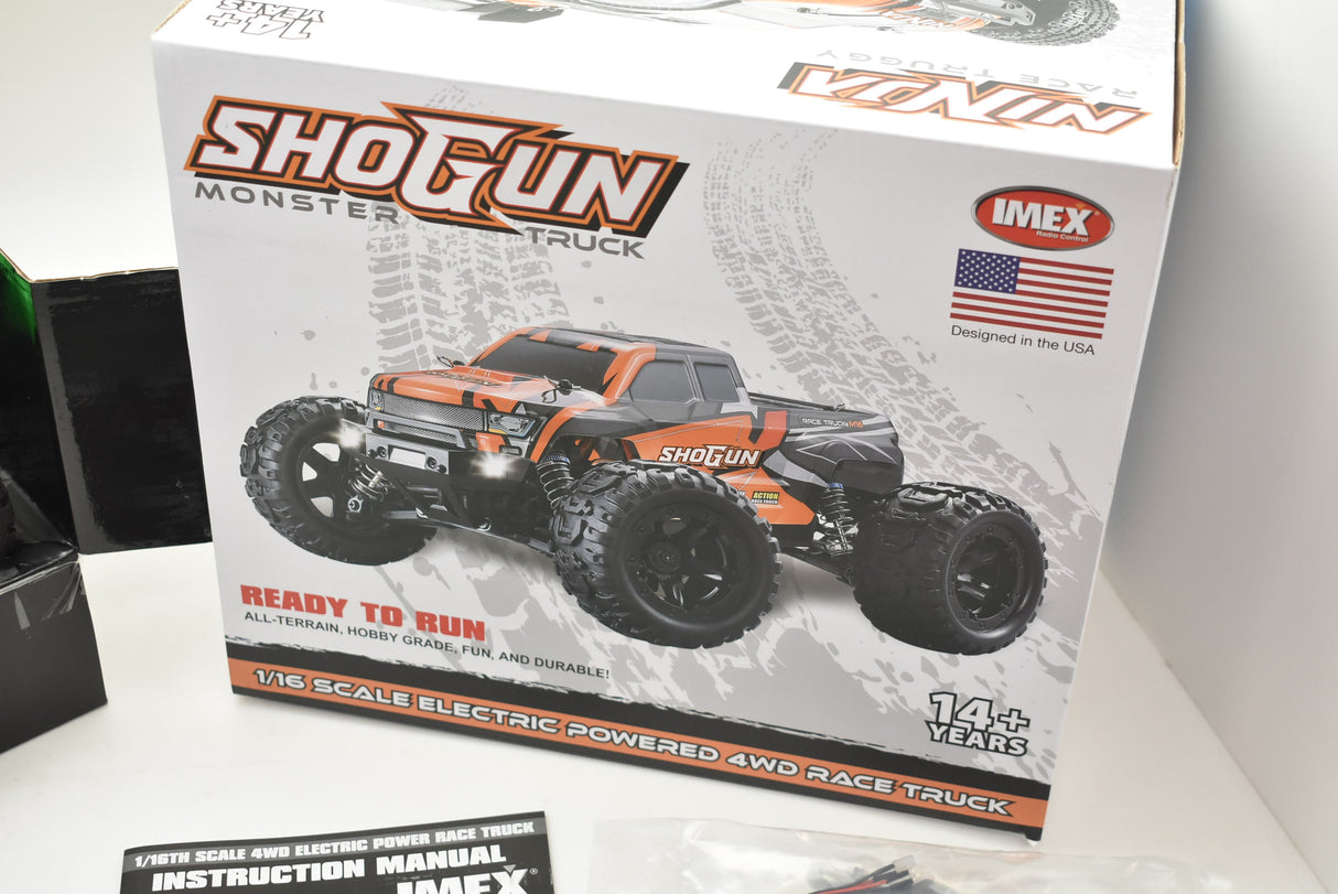 Orange/green 1/16 scale monster truck ready to run for IMX19025, rear view