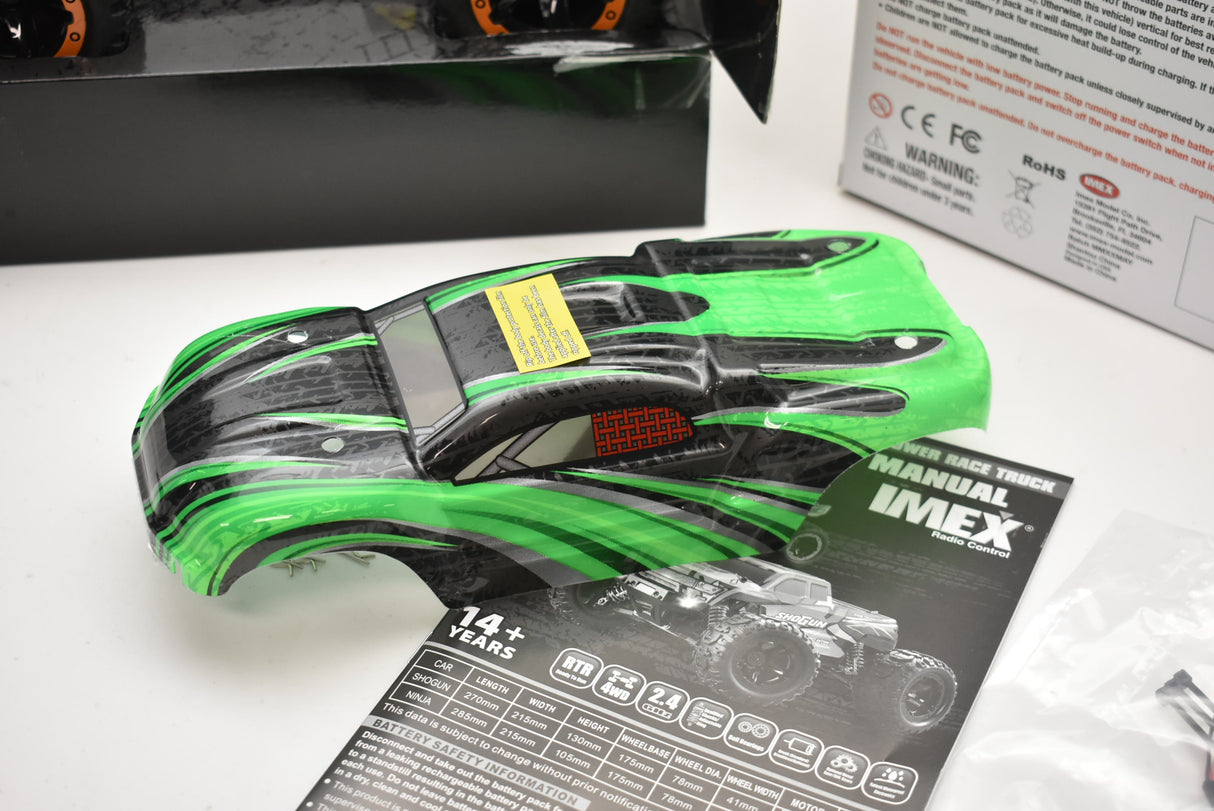 Green and black remote-controlled monster truck for ORANGE/GREEN IMX19025, rear view