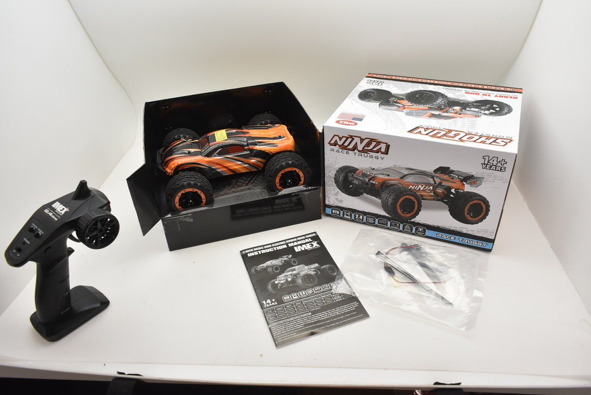 Remote control monster truck kit with instructions and charger for IMEX IMX19020