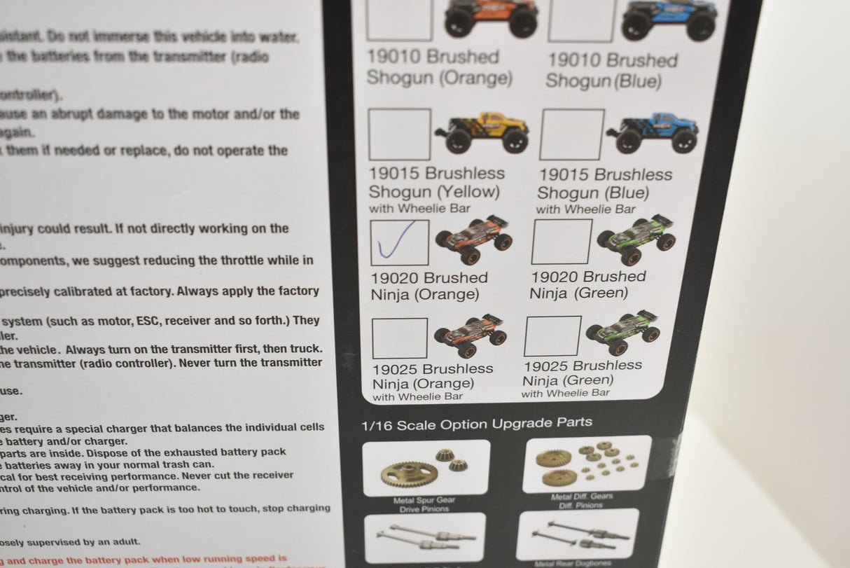Model lineup showing various brushless and brushed versions of the Ninja monster truck for ORANGE/GREEN IMX19025, rear view